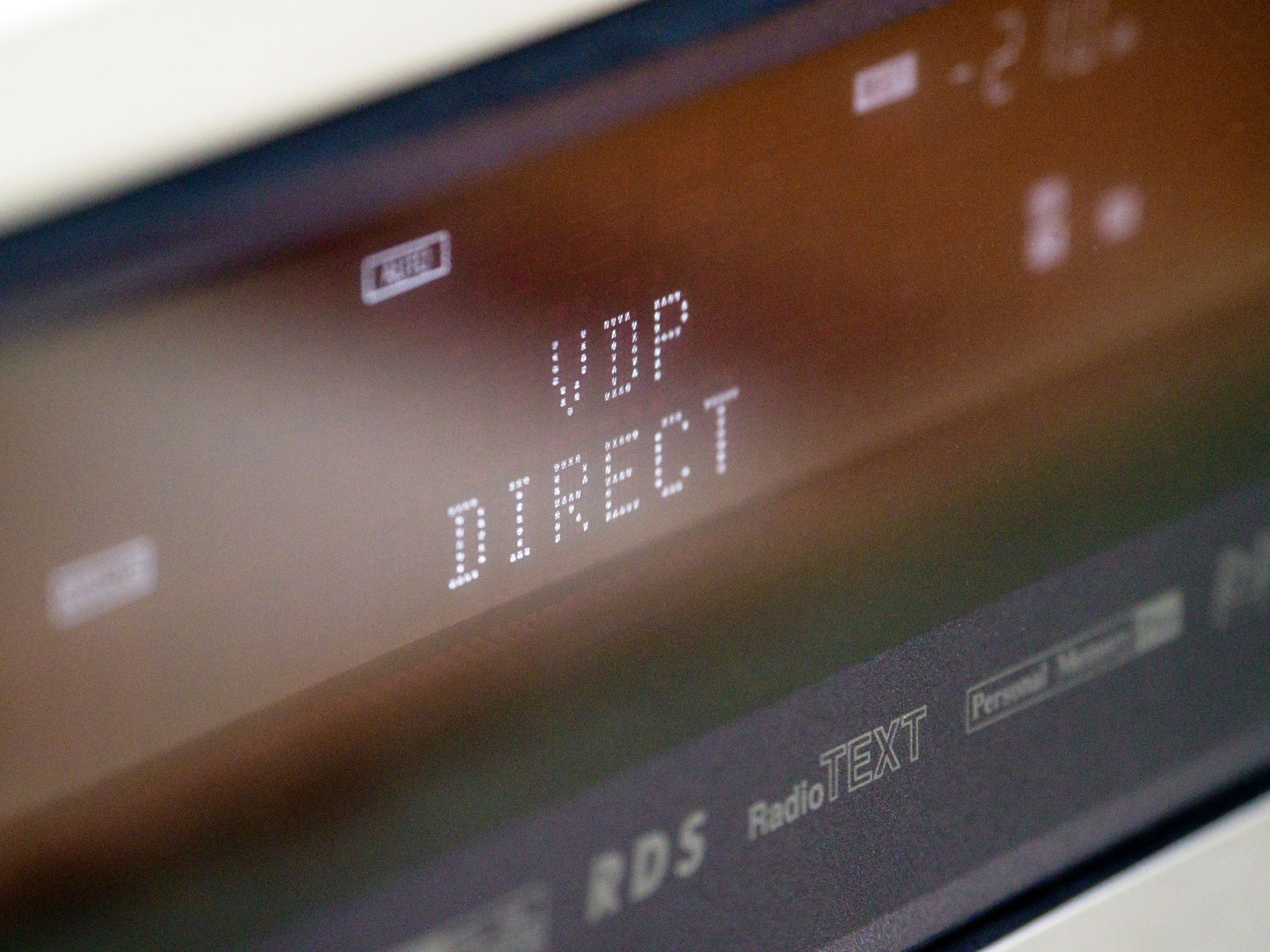 Extreme close-up of an electronic screen showing 'VDP DIRECT' in bold letters.